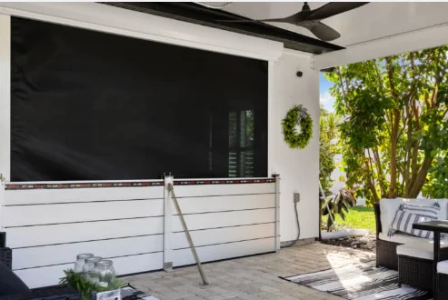 Flood Smart barrier with a support arm installed across a covered patio opening